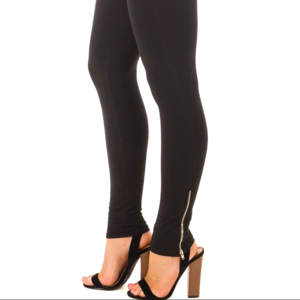 Black leggings with gold zipper